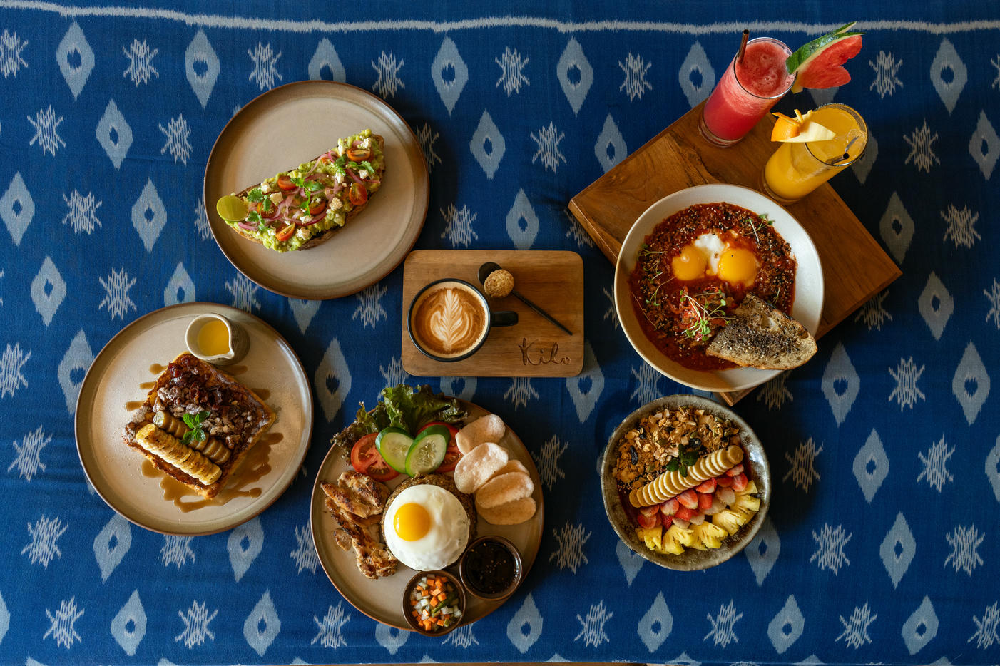 A vibrant restaurant scene in Canggu, Bali, showcasing trendy dining spots and delicious food, with Masmara Resort Canggu as the perfect place to stay.